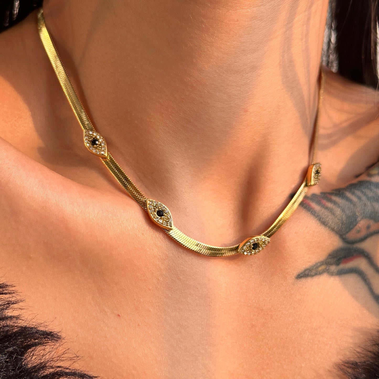 Exquisite 18k Gold Herringbone Necklace with Evil Eye Charms and Diamond Simulants 3