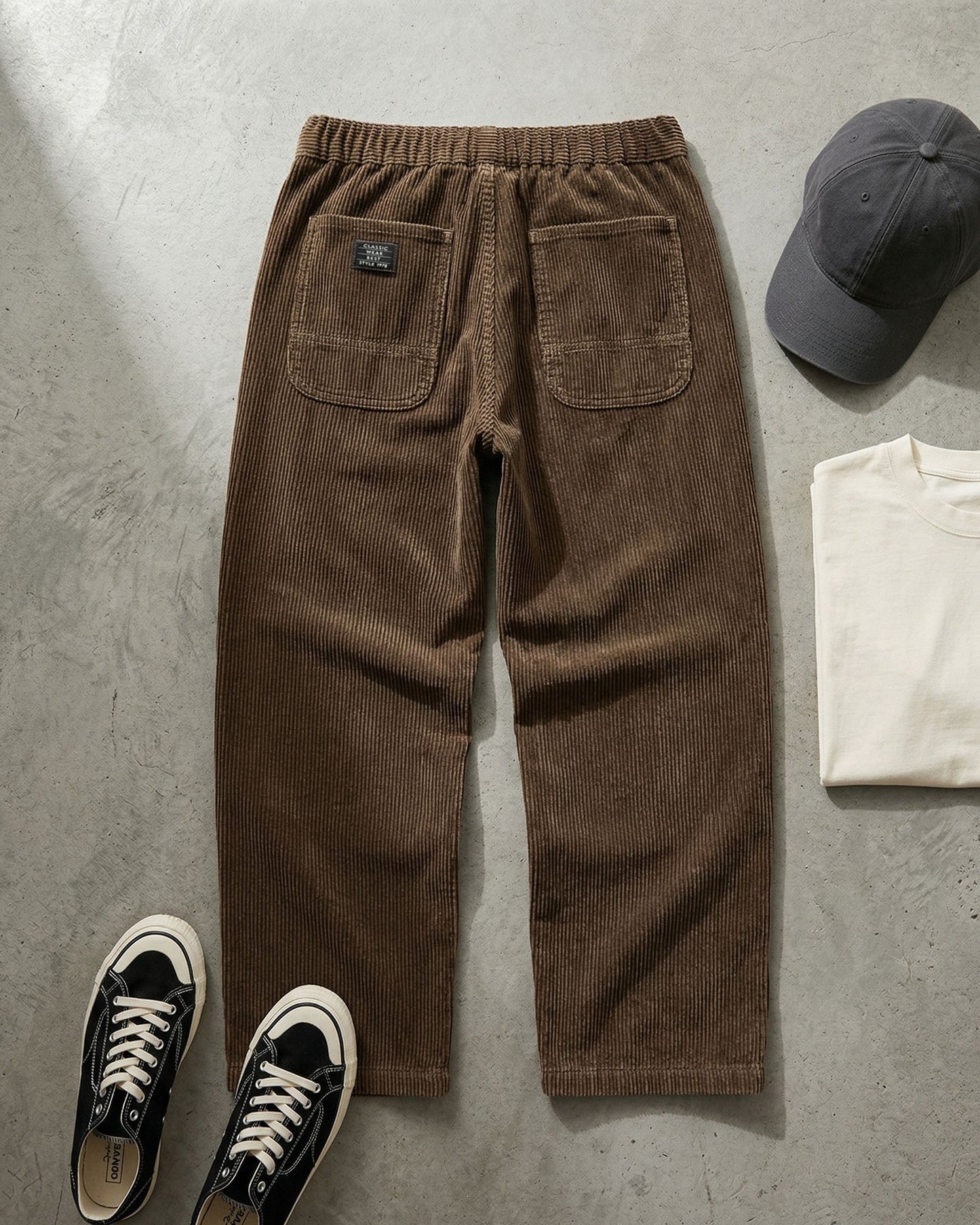 Men's Corduroy Trousers in Dark Brown – front view | Hensley London