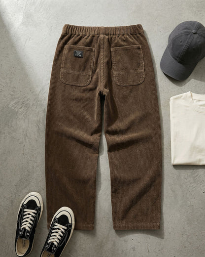 Men's Corduroy Trousers in Dark Brown – front view | Hensley London