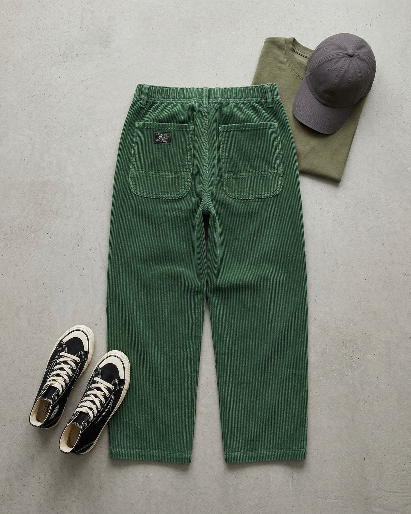 Men's Corduroy Trousers in Dark Green – front view | Hensley London