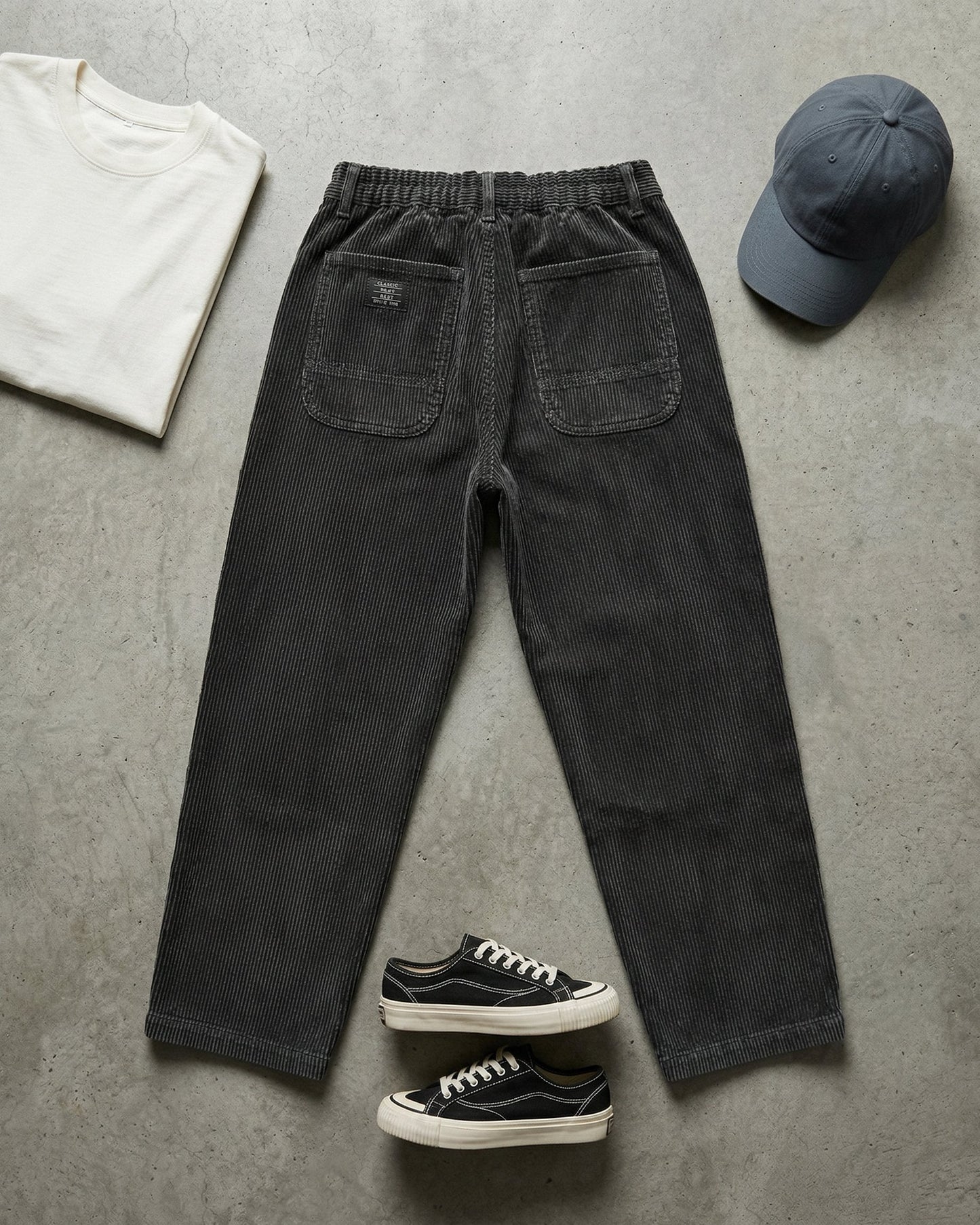 Men's Corduroy Trousers in Black – front view | Hensley London