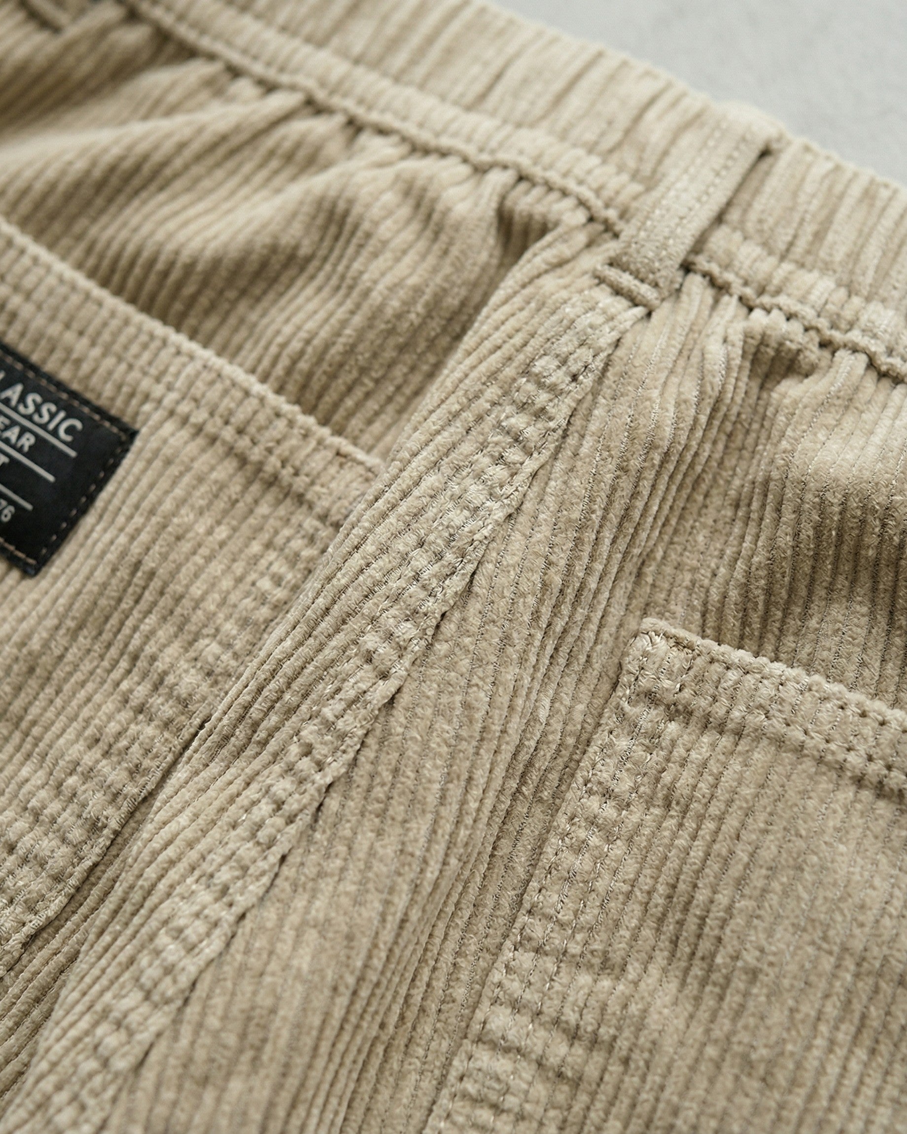 Men's Corduroy Trousers in Gray – fabric close-up | Hensley London