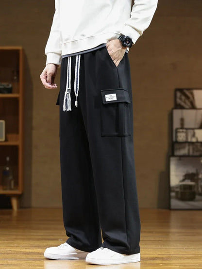 Men's Tapered Cargo Joggers in Black - side view | Hensley London