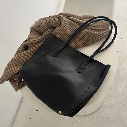 Women's Faux Leather Zip-Top Tote Bag in Black - product view | Hensley London