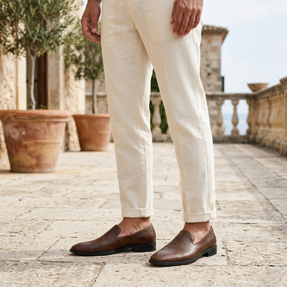 Men's Pointed-Toe Leather Loafers in Black – three-quarter view | Hensley London