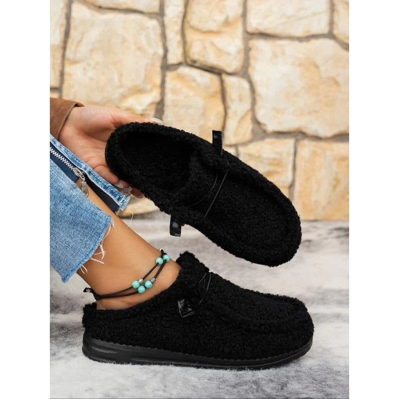 Women's Plush Moccasin Slippers in Black – product view | Hensley London