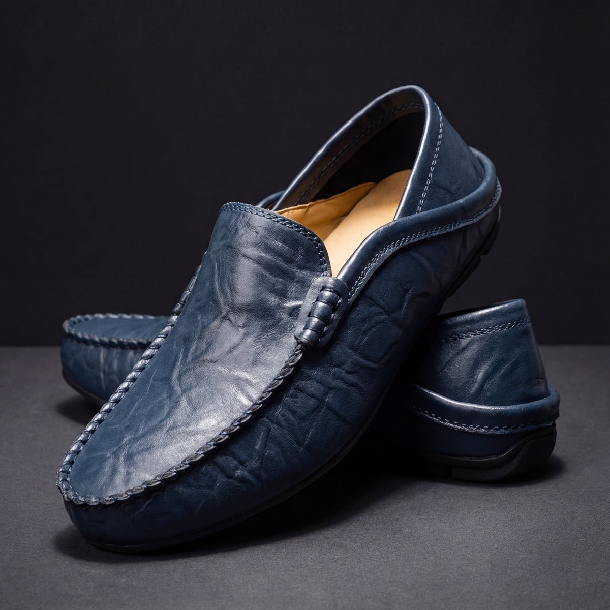 Men's Slip-On Loafers with Apron Stitching in Navy – three-quarter pair | Hensley London