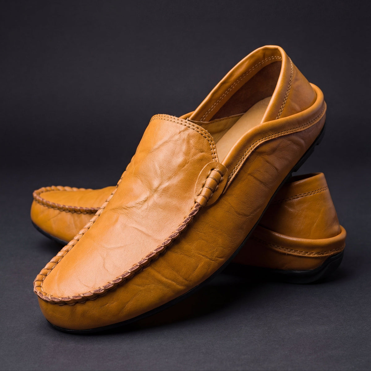 Men's Slip-On Loafers with Apron Stitching in Saddle – three-quarter pair | Hensley London