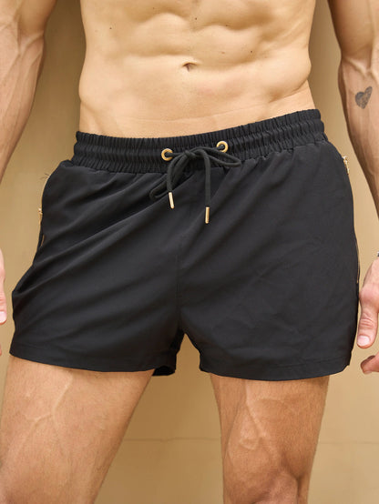 Men's Quick-Dry Swim Shorts in Black – close-up view | Hensley London