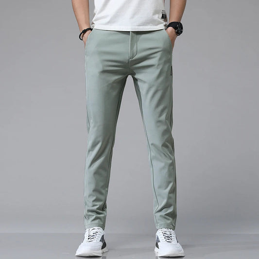 Men's Stretch Slim-Fit Trousers in Green - product view | Hensley London