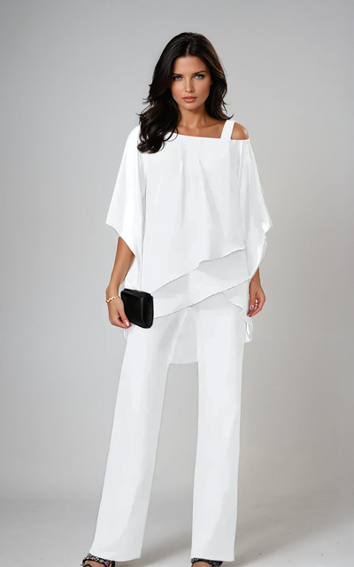White matching set with a draped asymmetric top and wide-leg trousers.