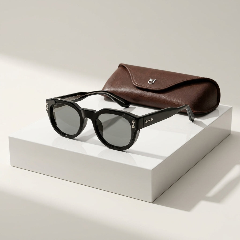 Women's Chunky Round Retro Sunglasses in Black – angled view | Hensley London