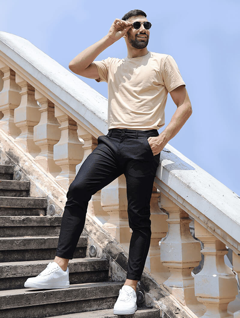 Men's Slim-Fit Stretch Trousers in Black – side view | Hensley London