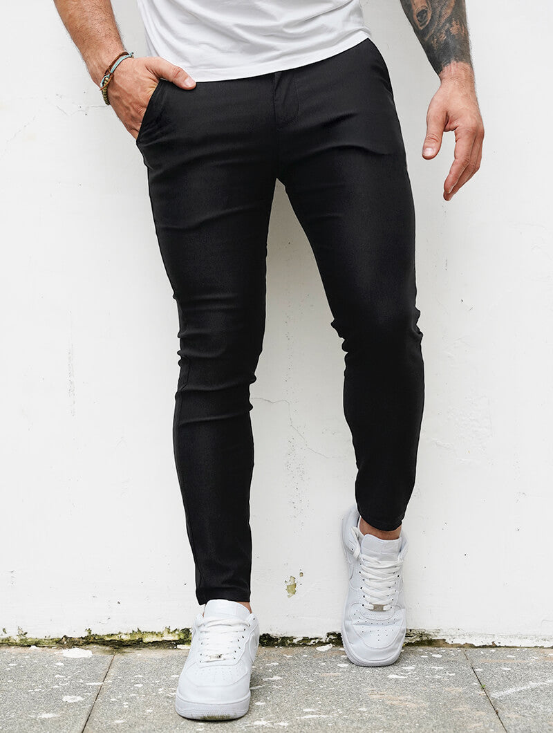 Men's Slim-Fit Stretch Trousers in Black – back view | Hensley London