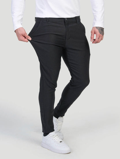 Men's Slim-Fit Stretch Trousers in Black – styled view | Hensley London