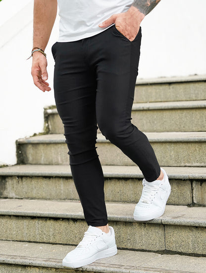 Men's Slim-Fit Stretch Trousers in Black – close-up view | Hensley London