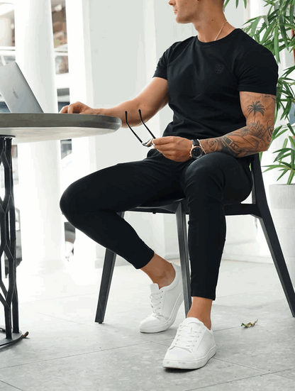 Men's Slim-Fit Stretch Trousers in Black – full view | Hensley London
