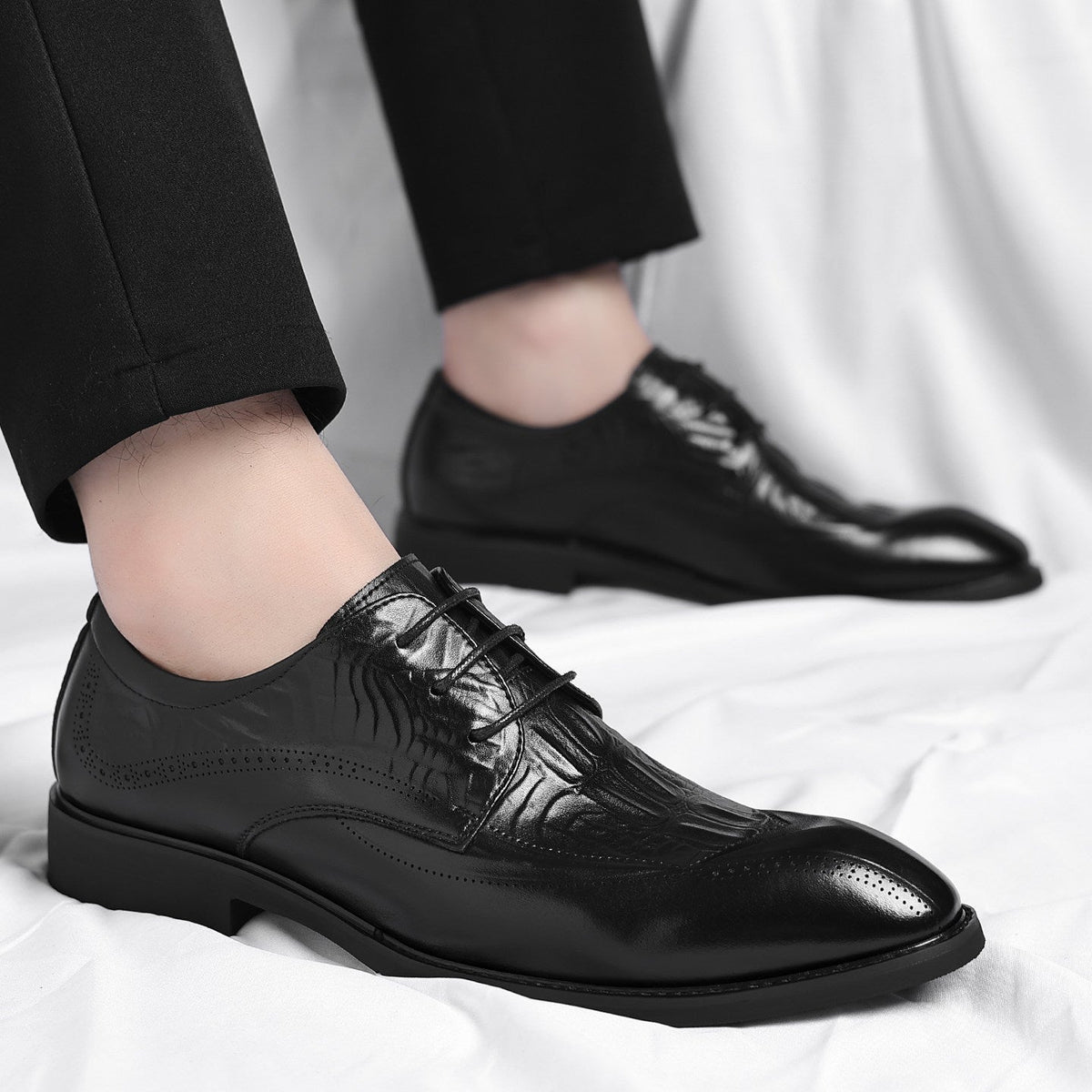 Men's Embossed Wingtip Lace-Up Dress Shoes in Black – worn side view | Hensley London