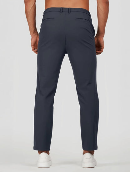 Men's Elastic Stretch Slim Fit Trousers in Navy Blue – back view | Hensley London