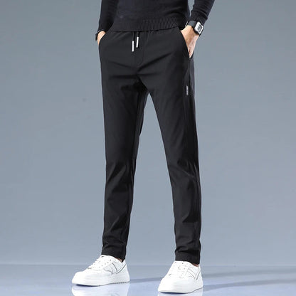 Men's Cotton Blend Slim Fit Trousers in Black – front view | Hensley London