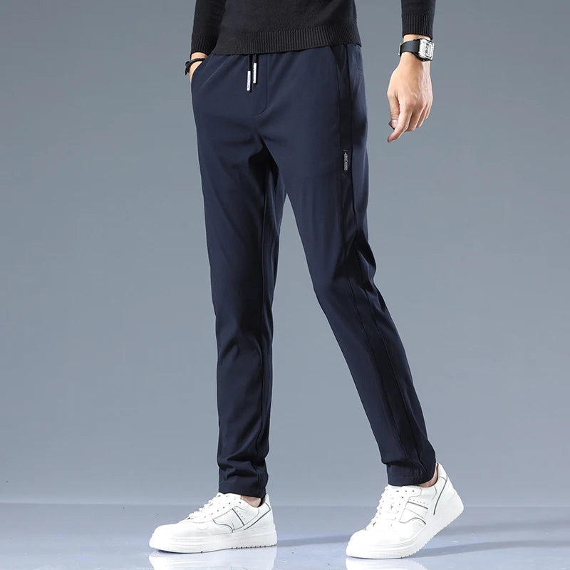 Men's Cotton Blend Slim Fit Trousers in Navy – front view | Hensley London