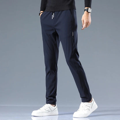 Men's Cotton Blend Slim Fit Trousers in Navy – front view | Hensley London