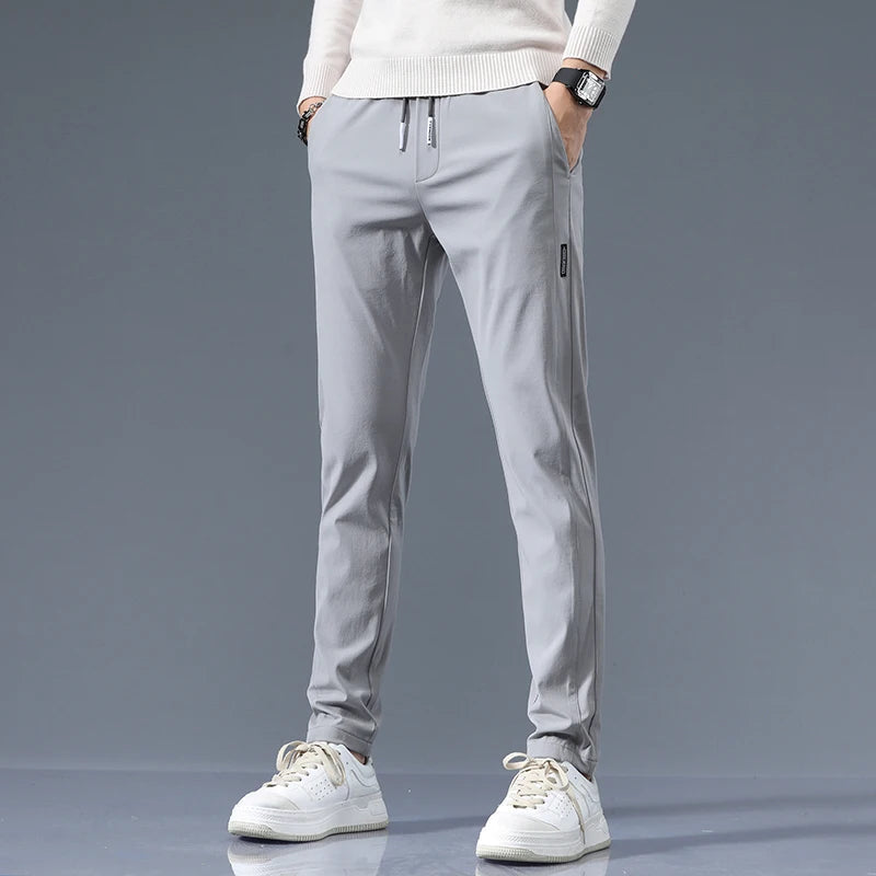 Men's Cotton Blend Slim Fit Trousers in Light Gray – front view | Hensley London