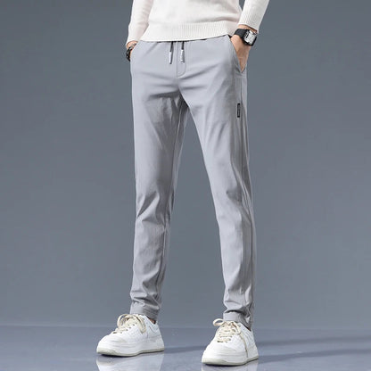 Men's Cotton Blend Slim Fit Trousers in Light Gray – front view | Hensley London