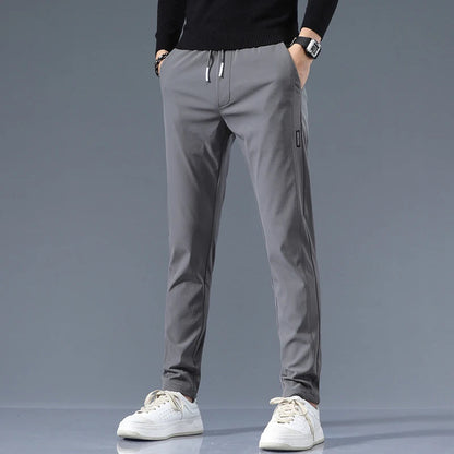 Men's Cotton Blend Slim Fit Trousers in Dark Gray – front view | Hensley London