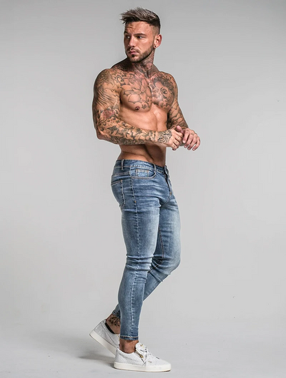 Men's Slim-Fit Stretch Jeans in Blue – styled view | Hensley London