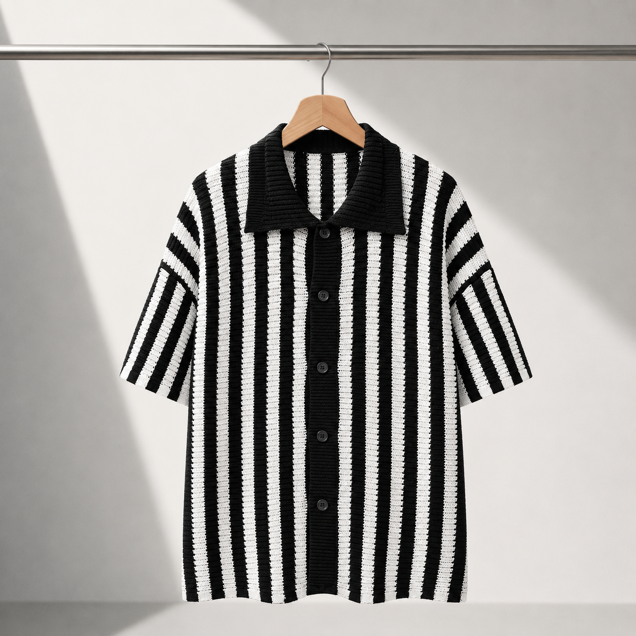 Men's Stripe Knit Polo Shirt in Black - detail view | Hensley London