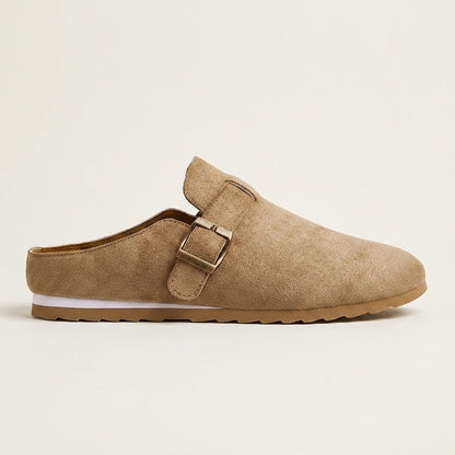 Women's Suede Buckle-Strap Mules in Sand – angled view | Hensley London