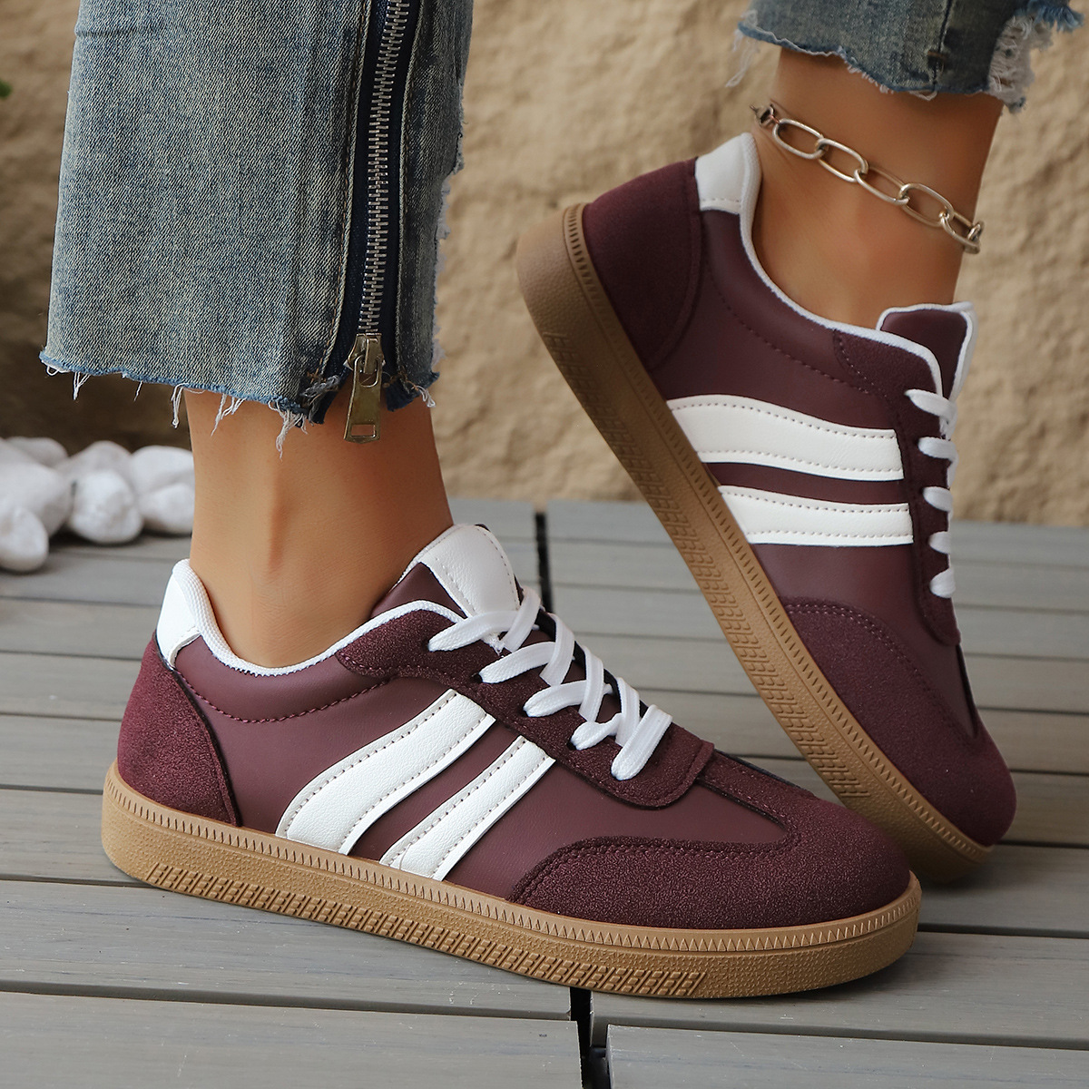 Women's Leather Retro Low-Top Sneakers in Black White – side view | Hensley London