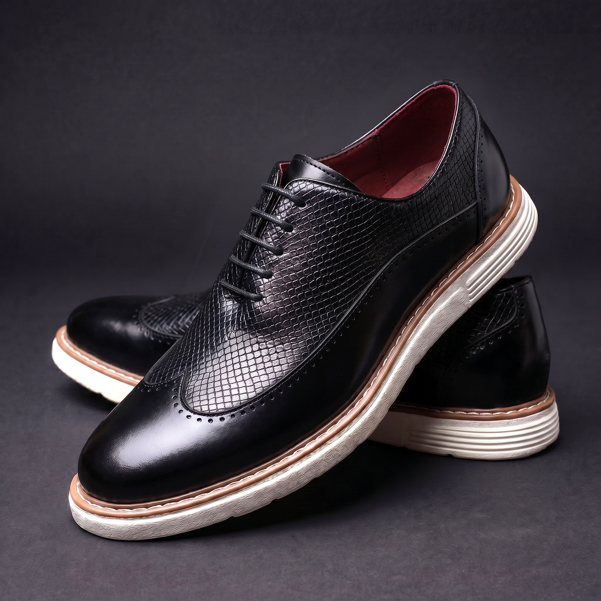 Men's Faux Leather Textured Wingtip Brogue Shoes in Black – three-quarter stacked pair | Hensley London
