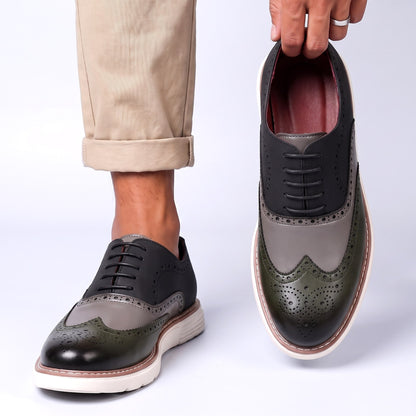 Men's Faux Leather Two-Tone Wingtip Brogue Shoes in Gray – worn and held front view | Hensley London