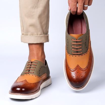 Men's Faux Leather Two-Tone Wingtip Brogue Shoes in Brown – worn and held front view | Hensley London