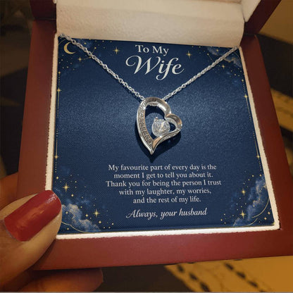 White-gold Forever Love heart necklace and Wife message card in open luxury box held in hand | Hensley London
