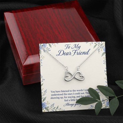 White-gold Endless Love infinity necklace and Friend message card beside luxury box and foliage | Hensley London