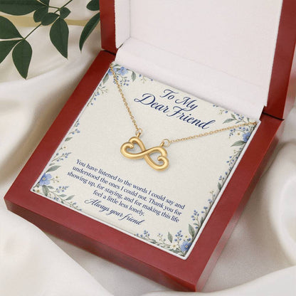 Yellow-gold Endless Love infinity necklace and Friend message card in open luxury box, angled view | Hensley London