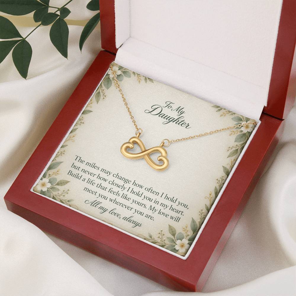Yellow-gold Endless Love infinity necklace and Daughter message card in open luxury box, angled view | Hensley London