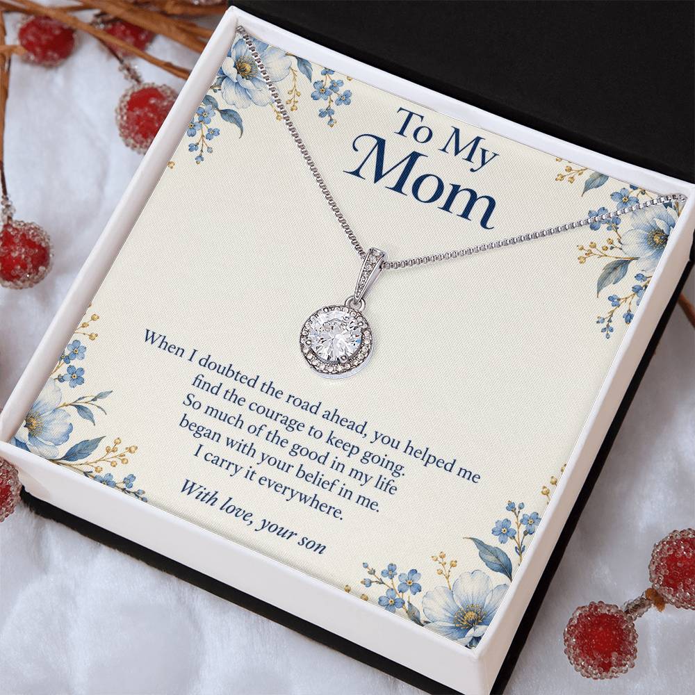 Eternal Hope crystal necklace and Mom message card in two-tone box beside red decorations | Hensley London