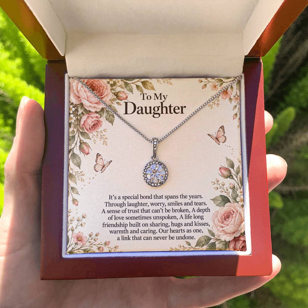 Eternal Hope Necklace with Rose Botanical daughter message card – Luxury Box held for scale | Hensley London
