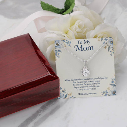 Eternal Hope crystal necklace and Mom message card beside closed luxury box and white flowers | Hensley London