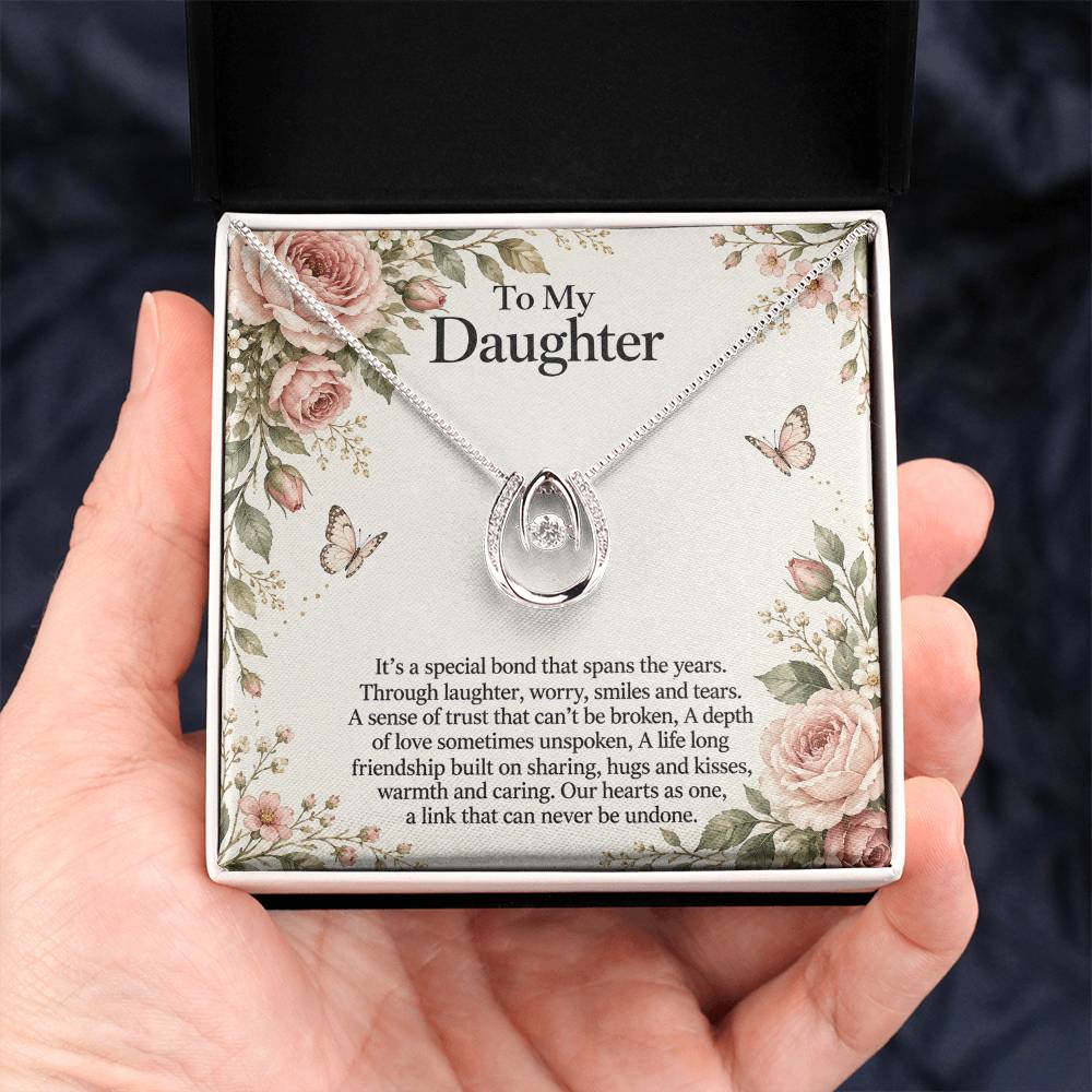 Lucky In Love teardrop necklace in white gold finish – Rose Botanical Two Tone Box held in hand | Hensley London