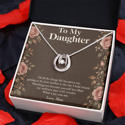Lucky In Love necklace and Daughter message card in two-tone box on dark fabric | Hensley London