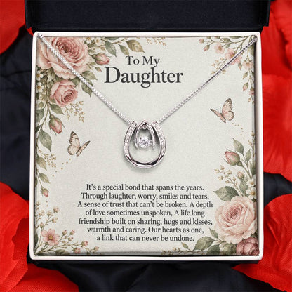 Lucky In Love teardrop necklace in white gold finish – Rose Botanical message card close-up in Two Tone Box | Hensley London