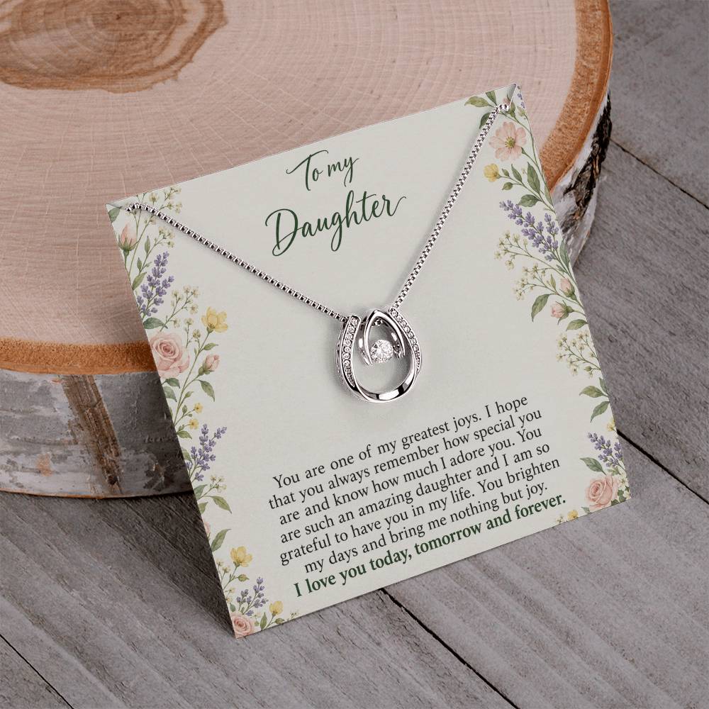 Lucky In Love teardrop necklace in white gold finish – Heirloom Garden necklace and message card on wood | Hensley London