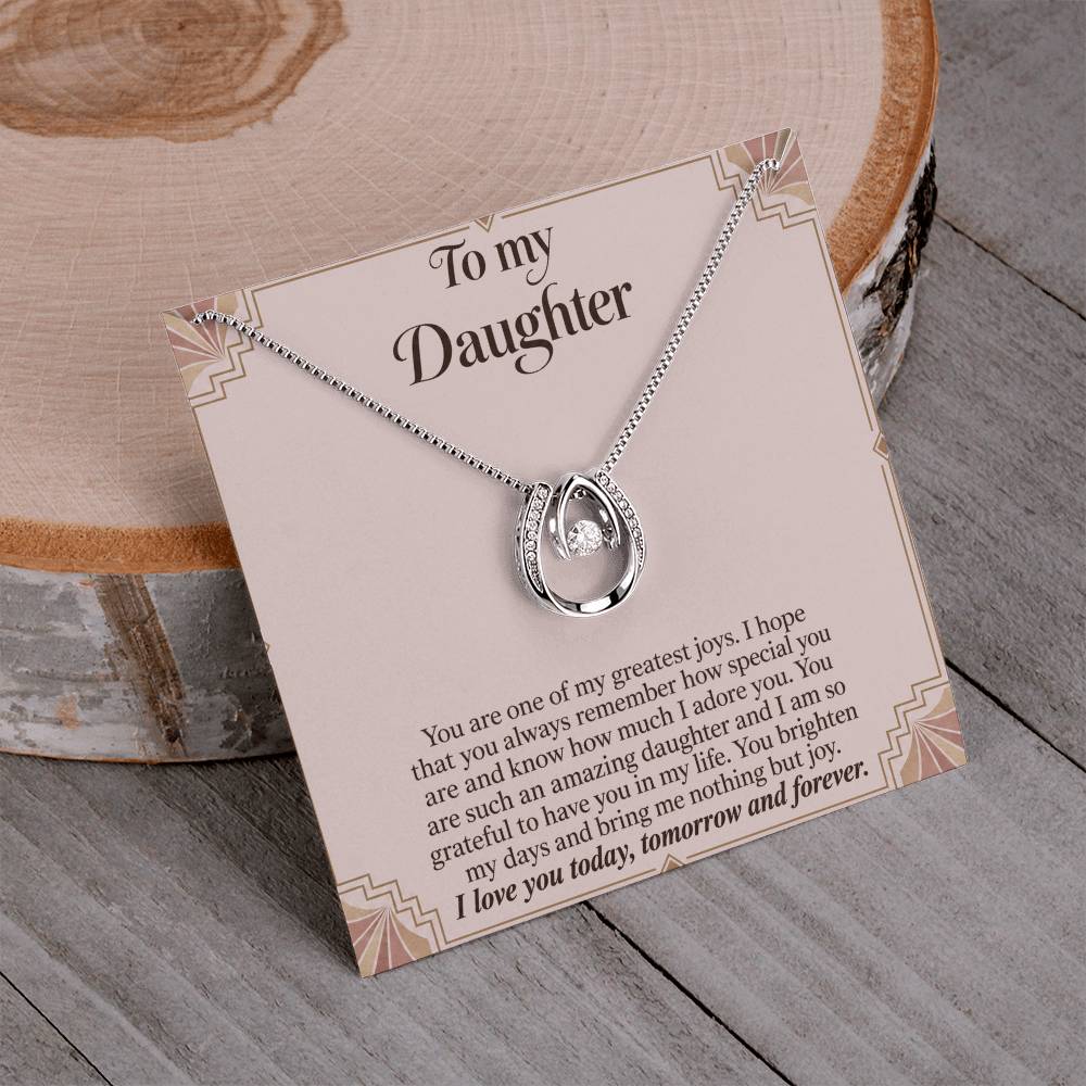 Lucky In Love teardrop necklace in white gold finish – Blush Art Deco necklace and message card on wood | Hensley London