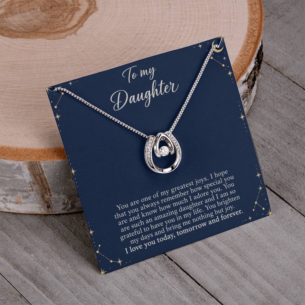 Lucky In Love teardrop necklace in white gold finish – Midnight Celestial necklace and message card on wood | Hensley London