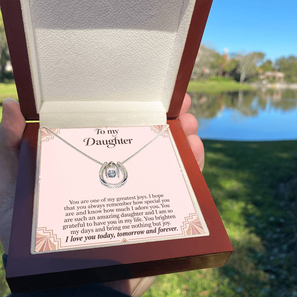Lucky In Love teardrop necklace in white gold finish – Blush Art Deco Luxury Box held outdoors | Hensley London